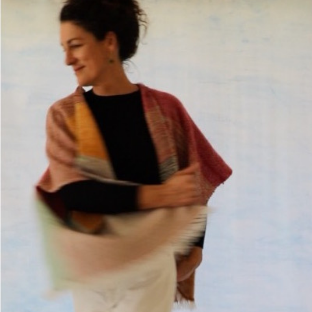 Woman twirling in poncho